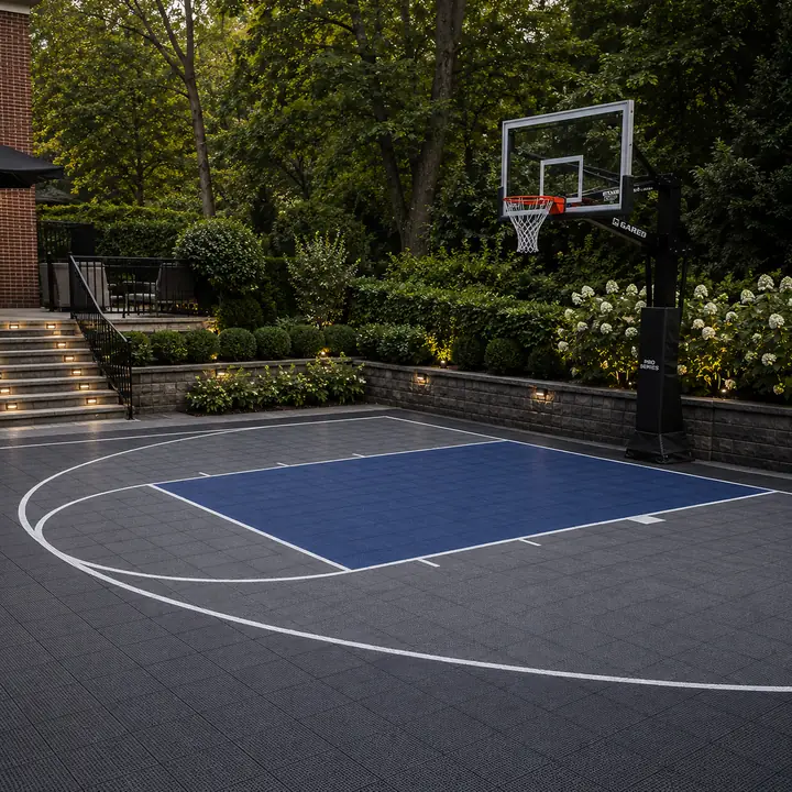 AM Developers LLC installed a commercial-grade in-ground hoop with tempered glass backboard, breakaway rim, court tiles, and regulation lines