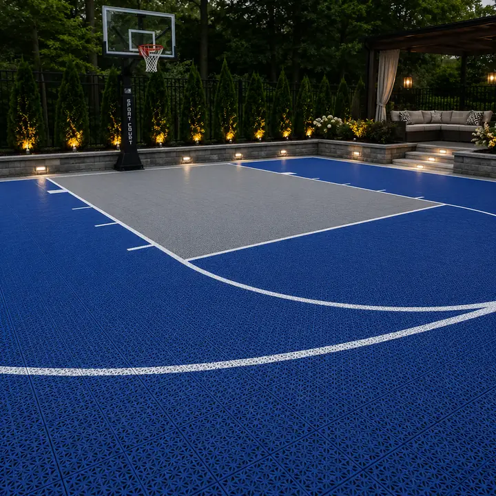 AM Developers LLC installed interlocking sport tiles with open-grid drainage, traction surfacing, regulation lines, and an in-ground hoop