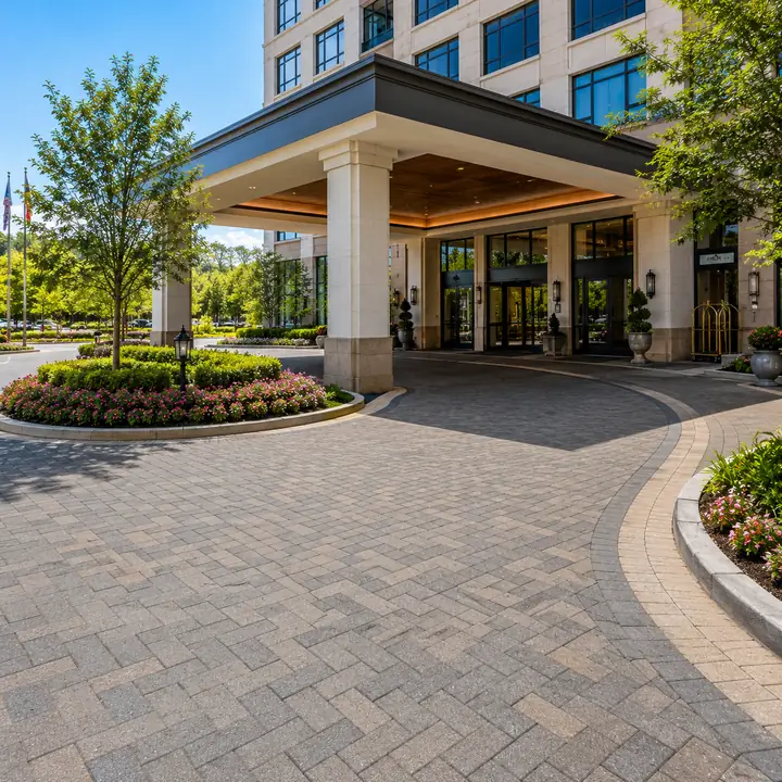 Commercial interlocking brick paver driveway entrance and porte-cochere with curved borders built by AM Developers LLC on Maryland Ave in Rockville MD.