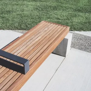 Custom wood slat bench with concrete base and metal skate deterrence installed by AM Developers LLC at Rockville Town Center MD.