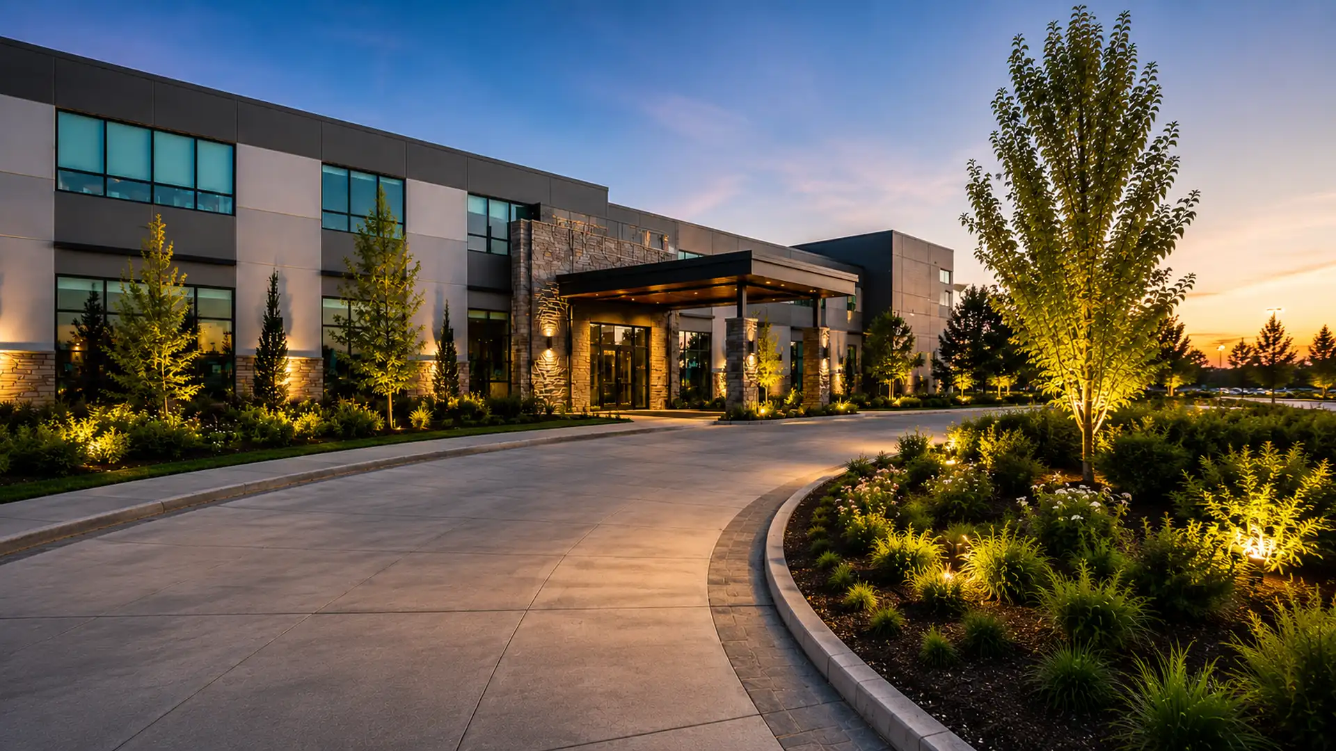 Commercial hotel porte-cochère concrete paver driveway constructed by Rockville MD commercial hardscaping contractor AM Developers LLC. You Dream It, We Build It.